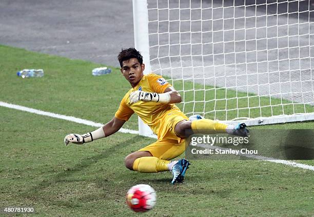 Izwan Mahbud of Singapore is beaten by Chuba Akporn of Arsenal during the Barclays Asia Trophy match between Arsenal and Singapore at National...