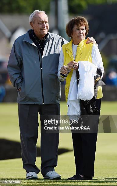 Arnold Palmer stands with his carm around his wife Kathleen during the Champion Golfers' Challenge ahead of the 144th Open Championship at The Old...