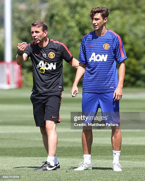 Assistant coach Albert Stuivenberg and Matteo Darmian of Manchester United in action during a first team training session as part of their pre-season...