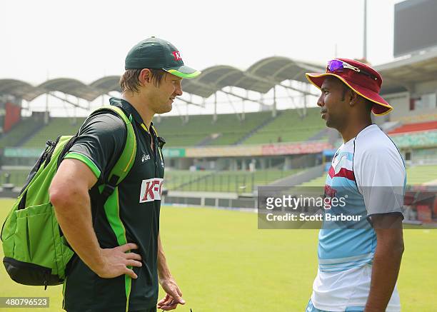 Shane Watson of Australia and Samuel Badree of the West Indies greet each other during an Australian ICC World Twenty20 Bangladesh 2014 training...