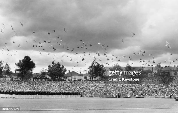 Thousands of pigeons are released at the climax of the opening ceremony of the British Empire Games at Eden Park stadium in Auckland, New Zealand,...