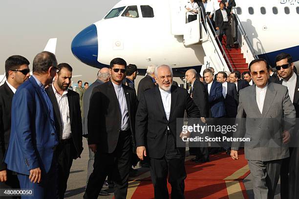 Iranian Foreign Minister Mohammad Javad Zarif touches down on Iranian soil after signing a landmark nuclear deal between Iran and six world powers,...