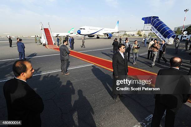 The plane of Iranian Foreign Minister Mohammad Javad Zarif touches down on Iranian soil after signing a landmark nuclear deal between Iran and six...