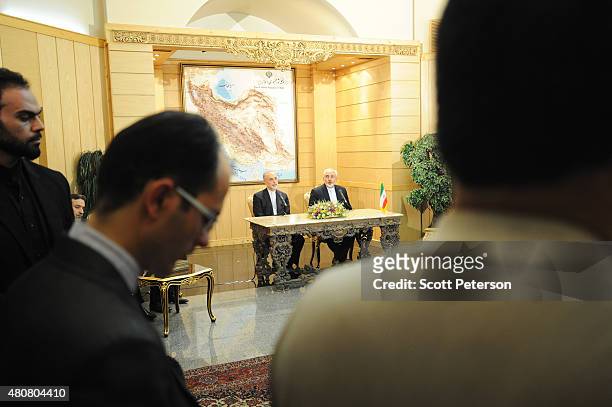 Iranian Foreign Minister Mohammad Javad Zarif and the head of Iran's Atomic Energy Organization Ali Akbar Salehi hold a press conference after...