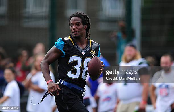 Sergio Brown of the Jacksonville Jaguars helps to coach a team of local school children during the NFL Launch of the Play 60 scheme at the Black...