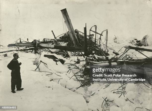 Explorer Frank Wild looking at the wreckage of the 'Endurance' during the Imperial Trans-Antarctic Expedition, 1914-17, led by Ernest Shackleton.