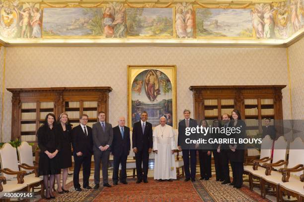 Pope Francis poses with US President Barack Obama , US Secretary of State John Kerry and members of the US delegation during a private audience on...