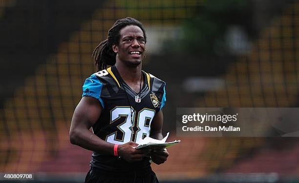 Sergio Brown of the Jacksonville Jaguars helps to coach a team of local school children during the NFL Launch of the Play 60 scheme at the Black...