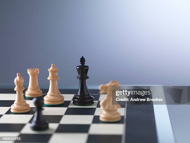 chess game, player preparing to check mate - king chess piece stock pictures, royalty-free photos & images