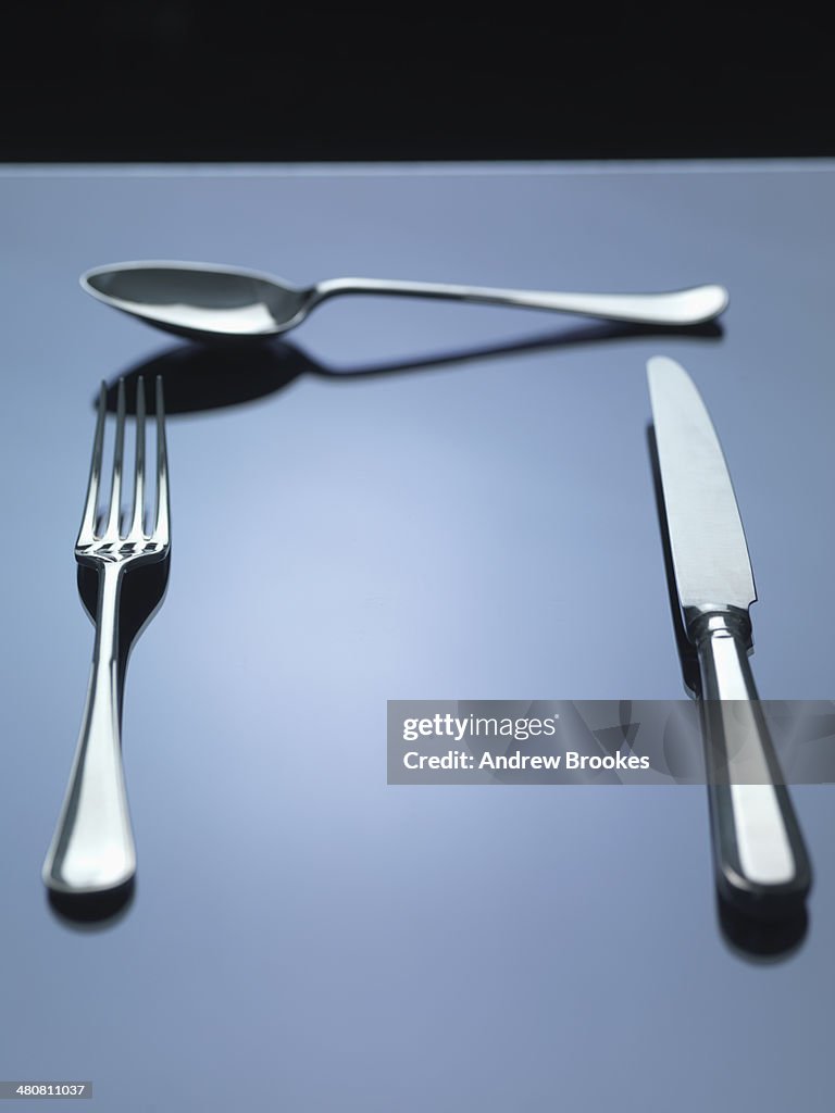 Knife, fork and spoon