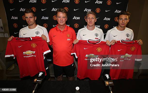 Manager Louis van Gaal of Manchester United poses with his new signings ahead of a press conference to unveil Bastian Schweinsteiger, Morgan...