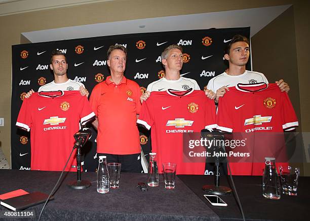 Manager Louis van Gaal of Manchester United poses with his new signings ahead of a press conference to unveil Bastian Schweinsteiger, Morgan...
