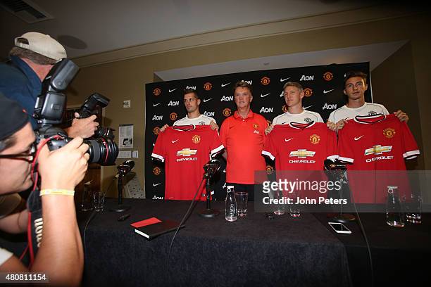 Manager Louis van Gaal of Manchester United poses with his new signings ahead of a press conference to unveil Bastian Schweinsteiger, Morgan...