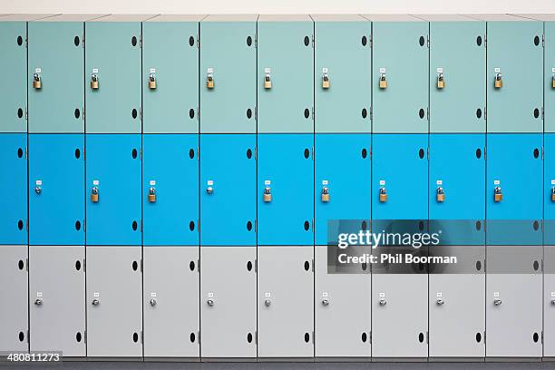 rows of school lockers with doors closed - high school locker room stock pictures, royalty-free photos & images