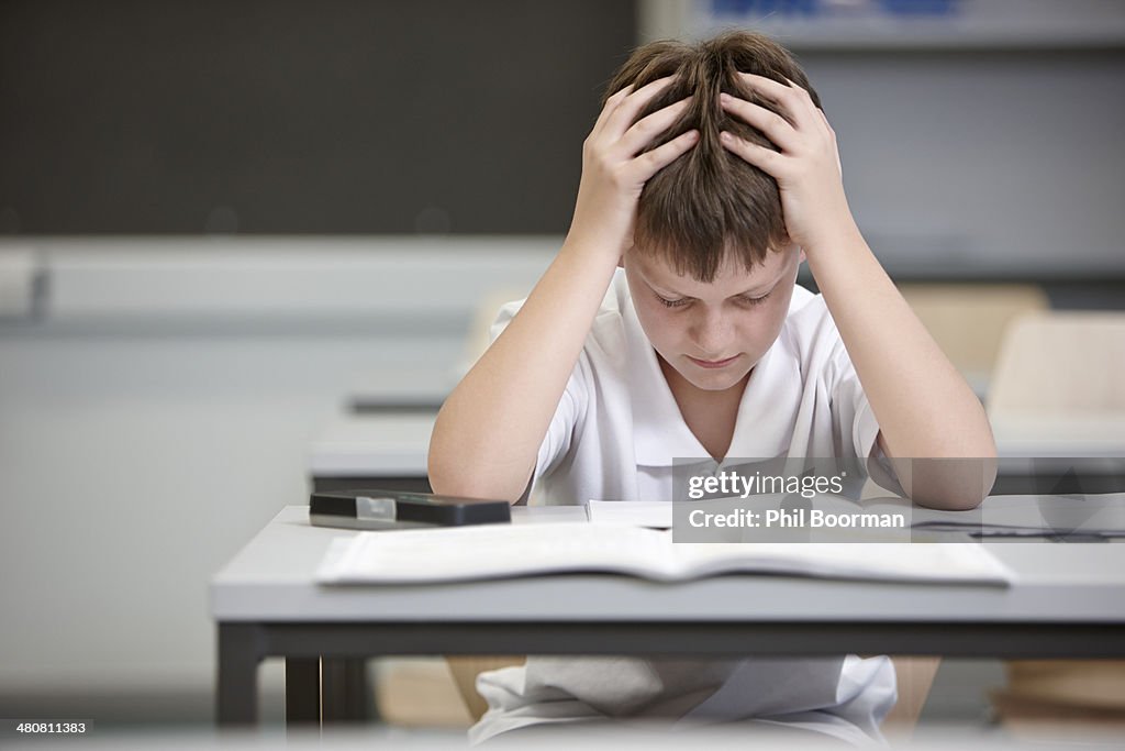 Boy Learning Problem School Schoolboy Struggling In Educational Exam High-Res Stock Photo - Getty ...