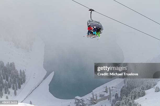 three people on ski lift in kuhtai, austria - kühtai stock-fotos und bilder