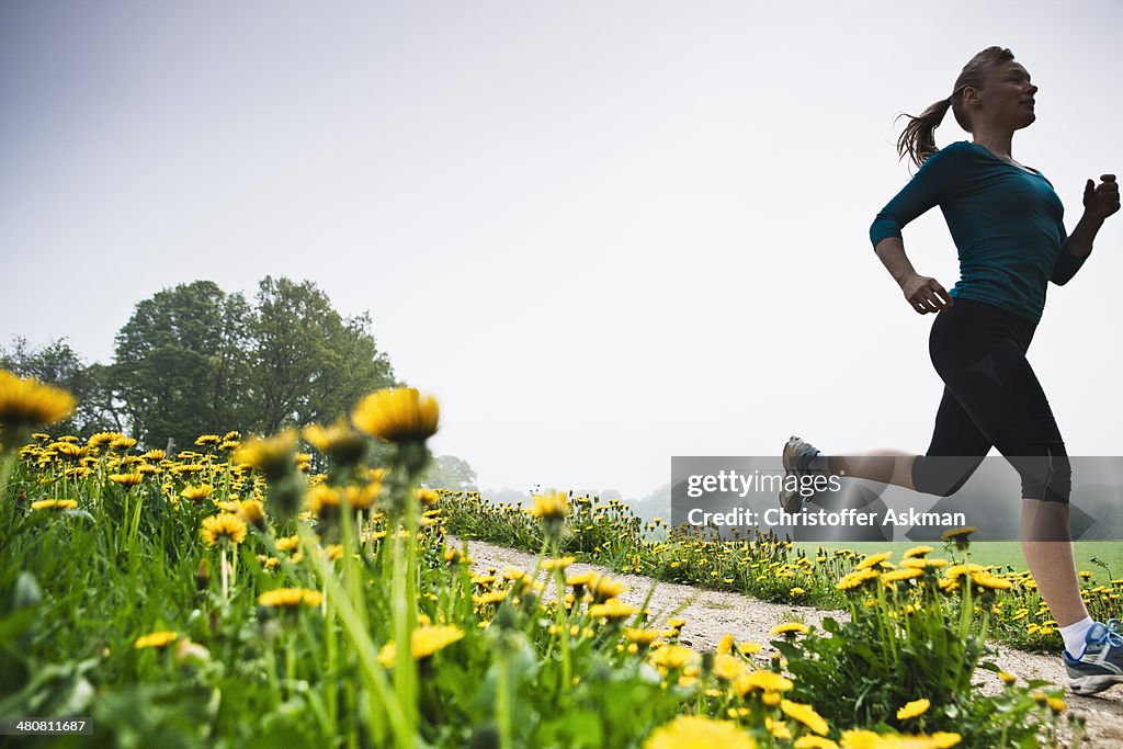 Mature woman running in countryside