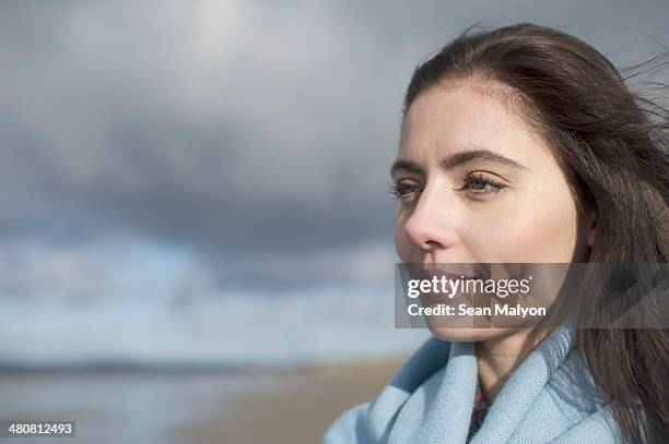 young woman looking at view - sean malyon stock-fotos und bilder