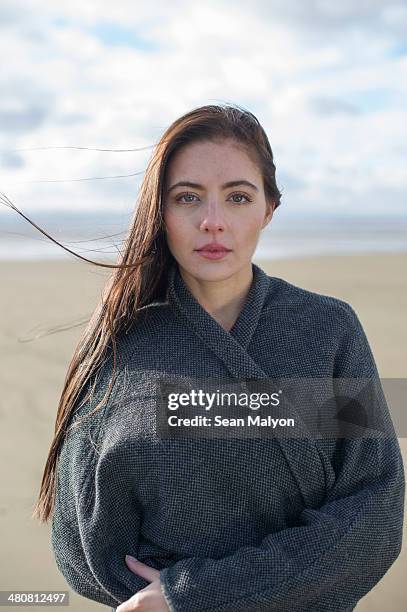 young woman wearing grey jacket - sean malyon stock pictures, royalty-free photos & images