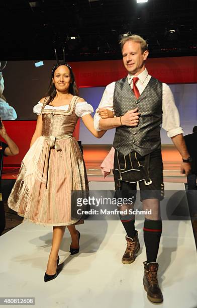 Alice Tumler and Martin Reichenauer pose on stage during the Pro Juventute Charity Fashion Show at Studio 44 on April 27, 2015 in Vienna, Austria.