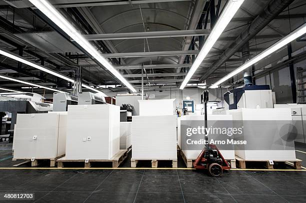 pallets of paper in printing warehouse - large printer stock pictures, royalty-free photos & images