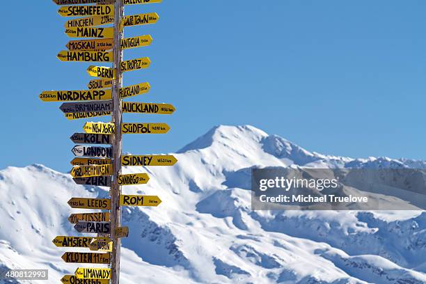 travellers' sign in davos, switzerland - davos switzerland stock pictures, royalty-free photos & images