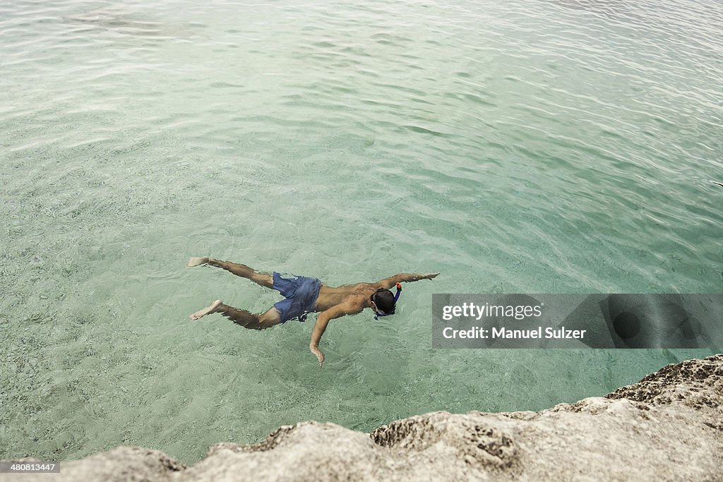 Man swimming in sea, Cala Goloritze, Sardinia, Italy