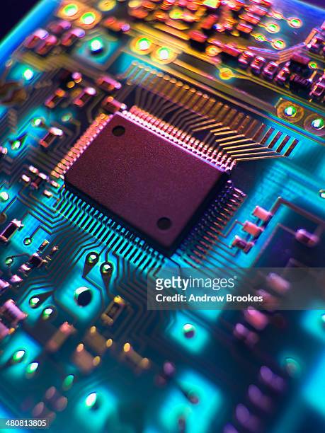printed circuit board. the central processing unit interprets and executes software instructions - cpu fotografías e imágenes de stock