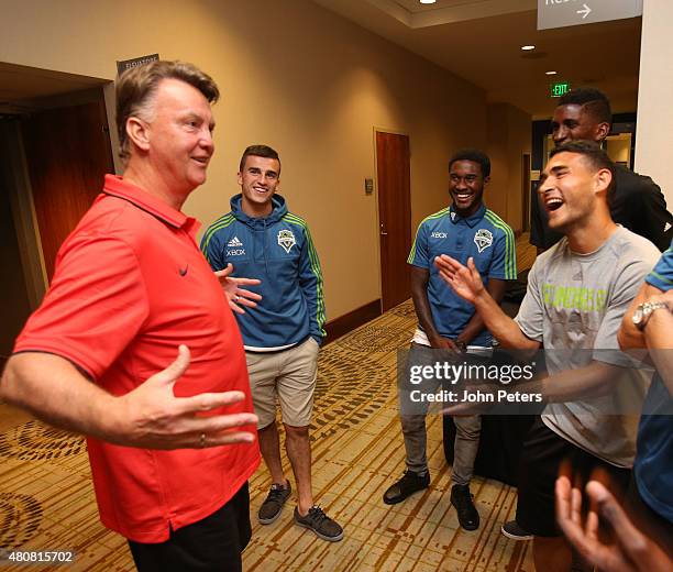 Manager Louis van Gaal of Manchester United speaks to Seattle Sounders players ahead of a press conference to unveil Bastian Schweinsteiger, Morgan...
