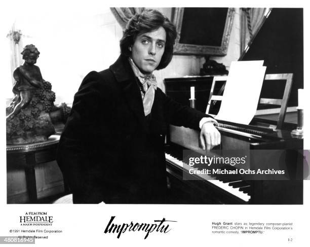 Actor Hugh Grant at a piano in a scene from the movie "Impromptu" , circa 1991.