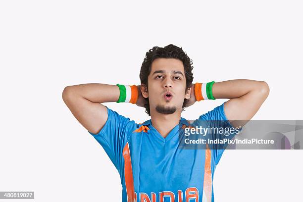 disappointed cricket fan with hands behind head looking away over white background - cricket jersey stock pictures, royalty-free photos & images