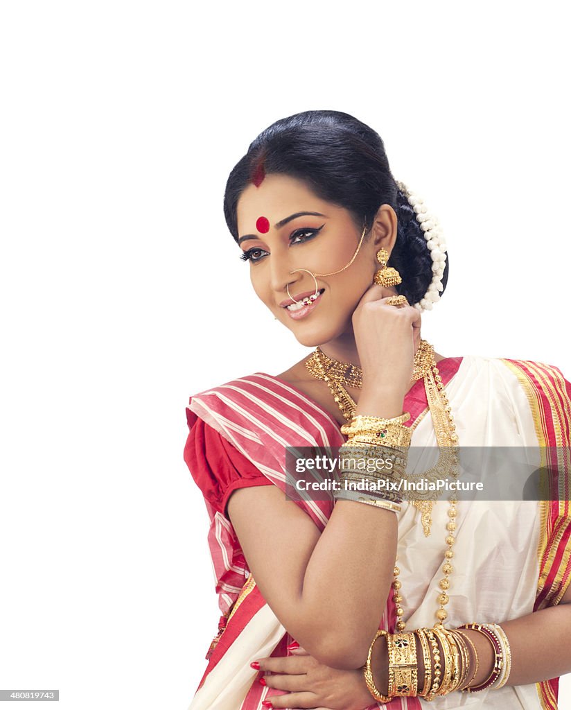 Thoughtful woman smiling over white background