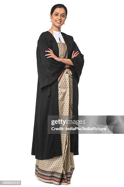 portrait of young female lawyer standing with arms crossed over white background - sari isolated stock pictures, royalty-free photos & images