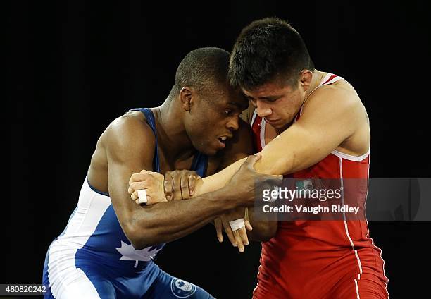 Dylan Williams of Canada and Ali Soto of Mexico compete in the Men's 59kg Greco-Roman Quarterfinal during the Toronto 2015 Pan Am Games at the...