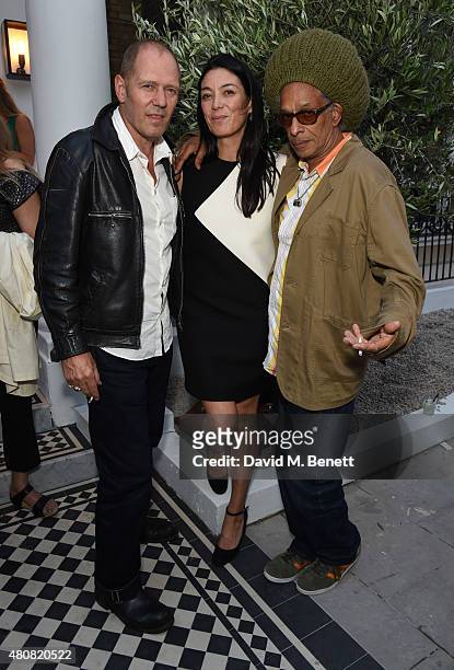 Paul Simonon; Tracy Lowy and Don Letts attend The Laslett pre-opening drinks reception at The Laslett on July 15, 2015 in London, England.