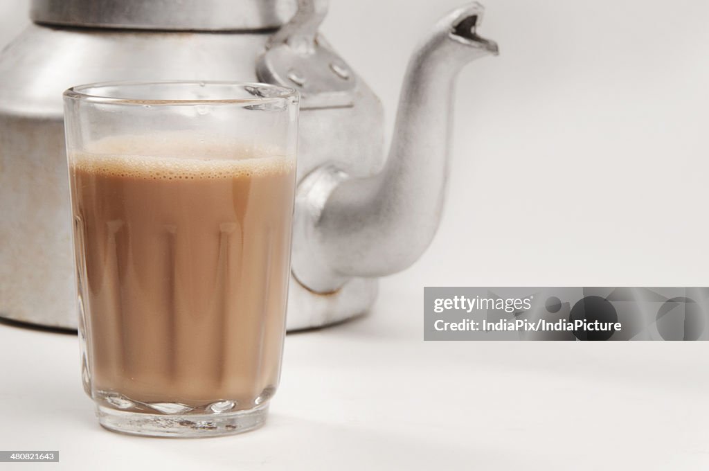 Glass Of Chai With An Old Fashioned Kettle Isolated Over White Background  High-Res Stock Photo - Getty Images