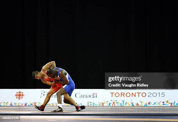 Miguel Martinez of Cuba and Bernardo Cardenas of Mexico compete in the Men's 66kg Greco-Roman Quarterfinals during the Toronto 2015 Pan Am Games at...