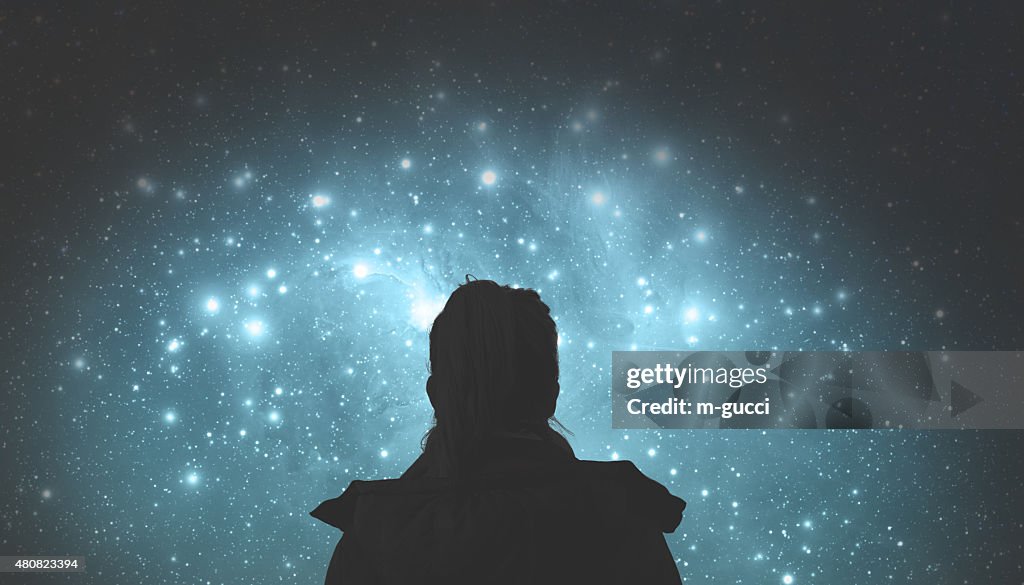 Girl watching the stars. Stars are digital illustration.