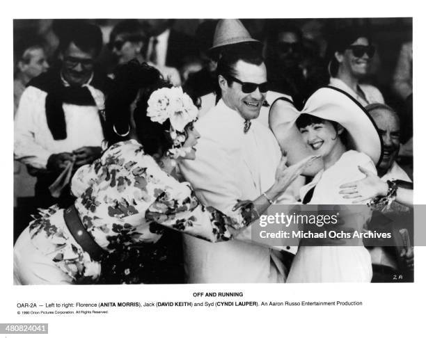 Actress Anita Morris, actor David Keith and Cyndi Lauper in a scene from the movie "Off and Running", circa 1991.