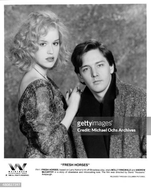 Actress Molly Ringwald and actor Andrew McCarthy pose for the movie " Fresh Horses ", circa 1988.