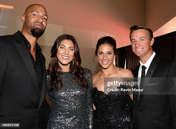 Player Jerramy Stevens with USWNT soccer players Hope Solo and Carli Lloyd and husband Brian Hollins attend The 2015 ESPYS at Microsoft Theater on...