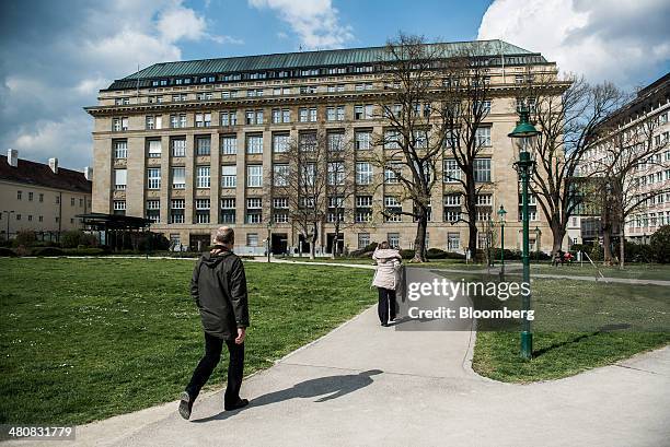 Pedestrians walk towards the headquarters of the Austrian central bank, also known as the Oesterreichische Nationalbank , in Vienna, Austria, on...