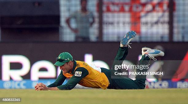 South Africa cricketer Faf du Plessis successfully take a catch to dismiss Netherlands batsman Michael Swart during the ICC World Twenty20 tournament...