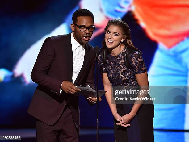 Actor Mike Epps and professional soccer player Alex Morgan speak onstage during The 2015 ESPYS at Microsoft Theater on July 15, 2015 in Los Angeles,...