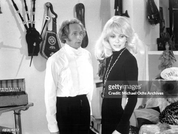 Actor Pierre Richard and actress Mireille Darc in a scene from the French movie "The Tall Blond Man with One Black Shoe" circa 1972.