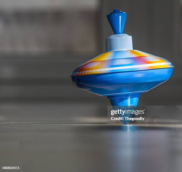 spinning top - spinning top stock pictures, royalty-free photos & images