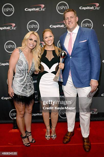 Musician Britney Spears with MMA fighter Ronda Rousey and NFL player JJ Watt posing with award for Best Female Athlete at The 2015 ESPYS at Microsoft...