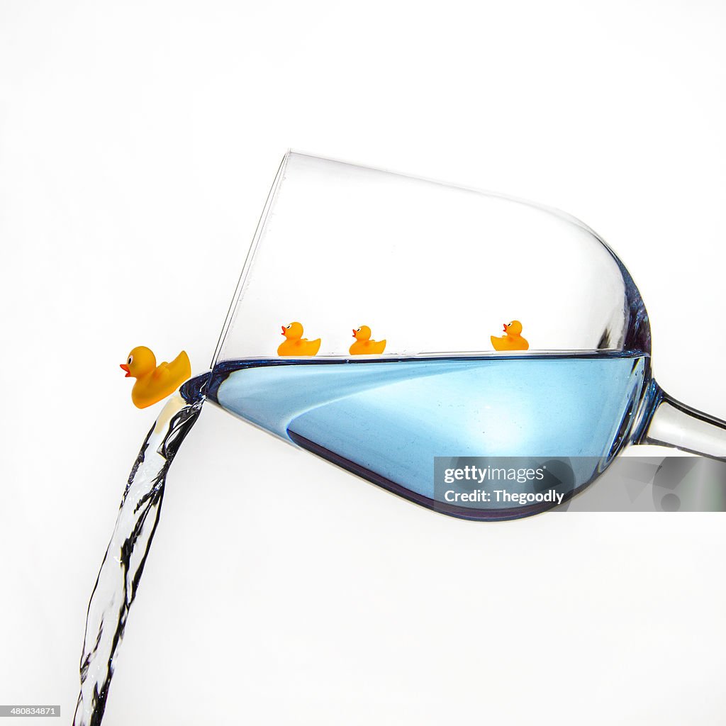 Rubber ducks in a wine glass