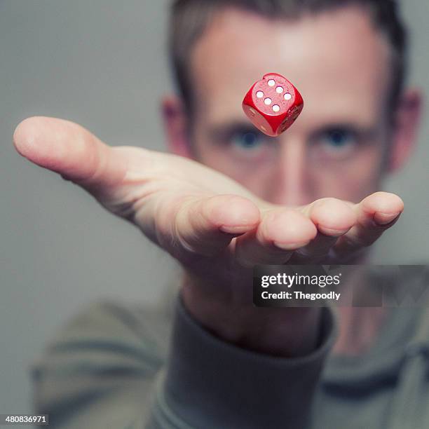 man throwing dice in air - hand throwing stock pictures, royalty-free photos & images