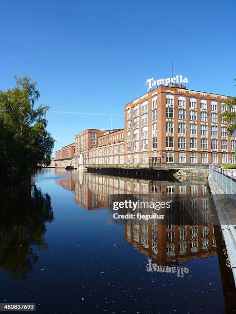 finland, pirkanmaa, tampere, brick factory reflected in channel - tampere stock pictures, royalty-free photos & images